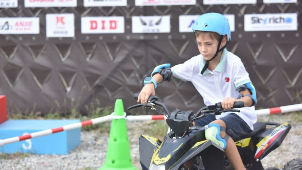 A teen rider leaning how to ride a used ATV